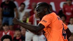 Valencia's Guinean defender #04 Mouctar Diakhaby celebrates scoring his team's first goal during the Spanish Liga football match between Sevilla FC and Valencia CF at the Ramon Sanchez Pizjuan stadium in Seville on August 11, 2023. (Photo by CRISTINA QUICLER / AFP)