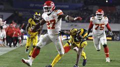 Kansas City Chiefs running back Kareem Hunt (27) scores a touchdown ahead of Los Angeles Rams free safety Lamarcus Joyner (20) as Chiefs offensive guard Cameron Erving (75) looks on during the first half of an NFL football game, Monday, Nov. 19, 2018, in Los Angeles. (AP Photo/Marcio Jose Sanchez)