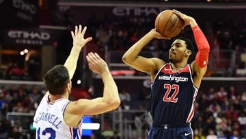 Feb 25, 2018; Washington, DC, USA; Washington Wizards forward Otto Porter Jr. (22) shoots over Philadelphia 76ers guard T.J. McConnell (12) during the first half at Capital One Arena. Mandatory Credit: Brad Mills-USA TODAY Sports