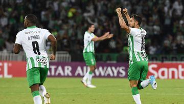 Colombia's Atletico Nacional Andres Andrade (R) celebrates a goal against Paraguay�s Olimpia during a Libertadores Cup football match in Medellin, Colombia, on March 3, 2022. (Photo by JOAQUIN SARMIENTO / AFP)
