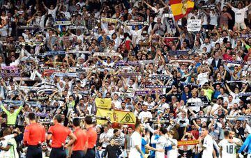 Real Madrid fans celebrate with their team.