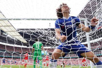 Chelsea's Brazilian defender David Luiz celebrates after hearing about the his club's new TV pay deal.