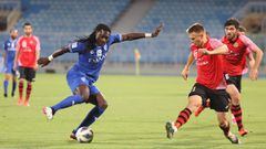 Hilal&#039;s forward Bafetimbi Gomis (L) is marked by Istiklol&#039;s defender Oleksiy Larin during the AFC Champions League group A match between Tajikistan&#039;s Istiklol and Saudi&#039;s Al-Hilal on April 24, 2021, at the Prince Faisal Bin Fahd footba