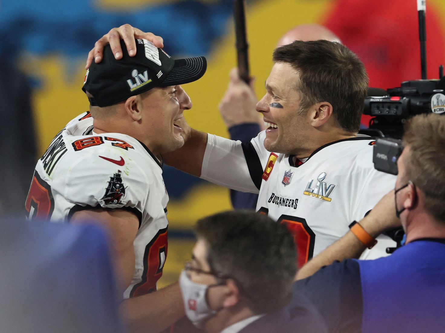 Tom Brady takes batting practice with Rob Gronkowski