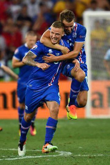 Iceland's defender Ragnar Sigurdsson couldn't have imagined scoring against England to help his team reach the Euro quarter finals. Here he is being jumped on by Kari Arnason.