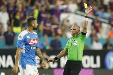 MIAMI, FLORIDA - AUGUST 07: Elseid Hysaj #23 of SSC Napoli receives a yellow card against FC Barcelona during the second half of a pre-season friendly match at Hard Rock Stadium on August 07, 2019 in Miami