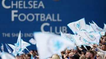Fans wave banners ahead of the UEFA Women's Champions League semi-final first leg football match between Chelsea and Barcelona at Stamford Bridge, in London, on April 22, 2023. (Photo by Adrian DENNIS / AFP)