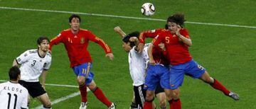 Carles Puyol (right) rises highest to head Spain's winner against Germany in the 2010 World Cup semi-finals.