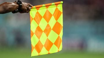 The Assistant Referee raises his flag for offside