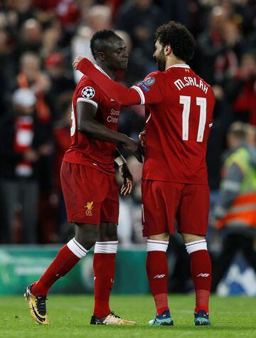 Sadio Mane celebrates with Mohamed Salah after scoring.