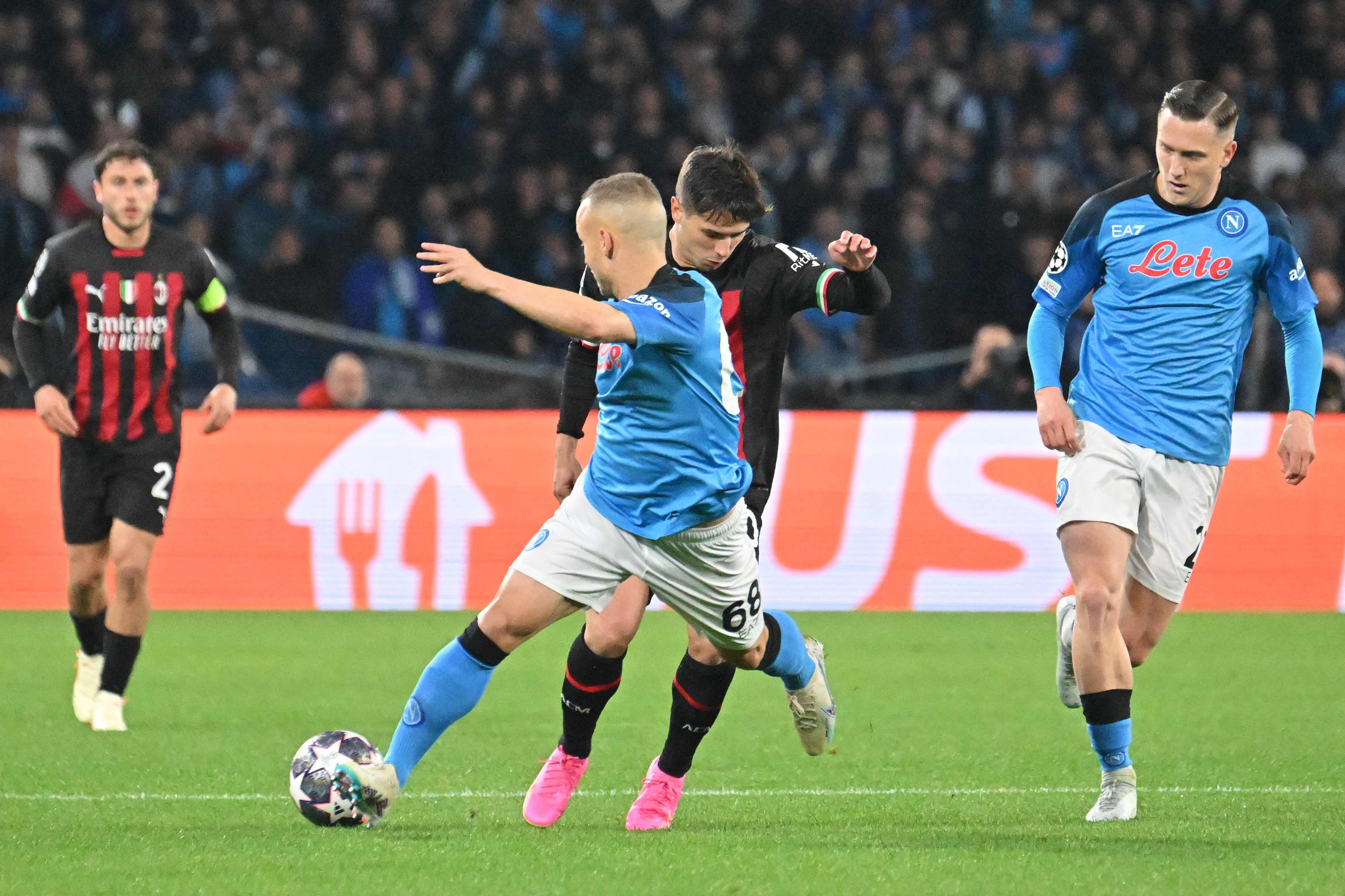 AC Milan midfielder Brahim Diaz challenges Napoli's Stanislav Lobotka. 