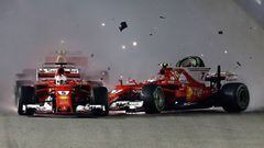 SINGAPORE - SEPTEMBER 17:  Sebastian Vettel of Germany driving the (5) Scuderia Ferrari SF70H and Kimi Raikkonen of Finland driving the (7) Scuderia Ferrari SF70H collide at the start during the Formula One Grand Prix of Singapore at Marina Bay Street Circuit on September 17, 2017 in Singapore.  (Photo by Lars Baron/Getty Images)