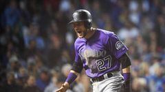 CHICAGO, IL - OCTOBER 02: Trevor Story #27 of the Colorado Rockies celebrates after scoring a run in the thirteenth inning to give the Rockies a 2-1 lead against the Chicago Cubs during the National League Wild Card Game at Wrigley Field on October 2, 2018 in Chicago, Illinois.   Stacy Revere/Getty Images/AFP == FOR NEWSPAPERS, INTERNET, TELCOS &amp; TELEVISION USE ONLY ==