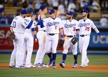 Aug 19, 2021; Los Angeles, California, USA; Los Angeles Dodgers left fielder AJ Pollock (11) right fielder Chris Taylor (3) center fielder Cody Bellinger (35) and the Dodgers celebrate the 4-1 victory against the New York Mets at Dodger Stadium. Mandatory