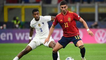 (FILES) In this file photo taken on October 10, 2021 France&#039;s defender Presnel Kimpembe (L) vies with Spain&#039;s midfielder Ferran Torres during the Nations League final football match between Spain and France at San Siro stadium in Milan. - Barcel