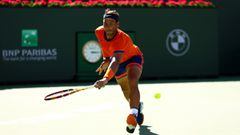 INDIAN WELLS, CALIFORNIA - MARCH 14: Rafael Nadal of Spain plays a backhand against Dan Evans of Great Britain in their third round match on Day 8 of the BNP Paribas Open at the Indian Wells Tennis Garden on March 14, 2022 in Indian Wells, California.   C