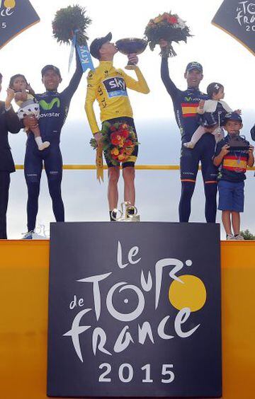 Team Sky rider Chris Froome of Britain (C), the race leader's yellow jersey, celebrates his overall victory on the podium with second placed Movistar rider Nairo Quintana of Colombia (L) and third placed Movistar rider Alejandro Valverde of Spain (R) after the 109.5-km (68 miles) final 21st stage of the 102nd Tour de France cycling race from Sevres to Paris Champs-Elysees, France, July 26, 2015.       REUTERS/Stephane Mahe