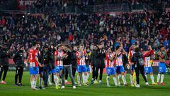 Girona's Spanish coach Michel (C,L) and team members celebrate victory at the end of the Spanish league football match between Girona FC and Club Atletico de Madrid  at the Montilivi stadium in Girona on January 3, 2024. Girona won 4-3. (Photo by Pau BARRENA / AFP)