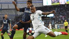 Minnesota United forward Angelo Rodriguez (9) attempts a shot while being defended by Los Angeles Galaxy midfielder Jonathan dos Santos (8) in the first half of an MLS soccer game, Wednesday, April 24, 2019, in St. Paul, Minn. (Aaron Lavinsky/Star Tribune via AP)