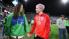 SAN DIEGO, CALIFORNIA - NOVEMBER 11: Megan Rapinoe #15 of OL Reign holds hands with Sue Bird after losing to NJ/NY Gotham FC in the 2023 NWSL Championship game at Snapdragon Stadium on November 11, 2023 in San Diego, California.   Meg Oliphant/Getty Images/AFP (Photo by Meg Oliphant / GETTY IMAGES NORTH AMERICA / Getty Images via AFP)