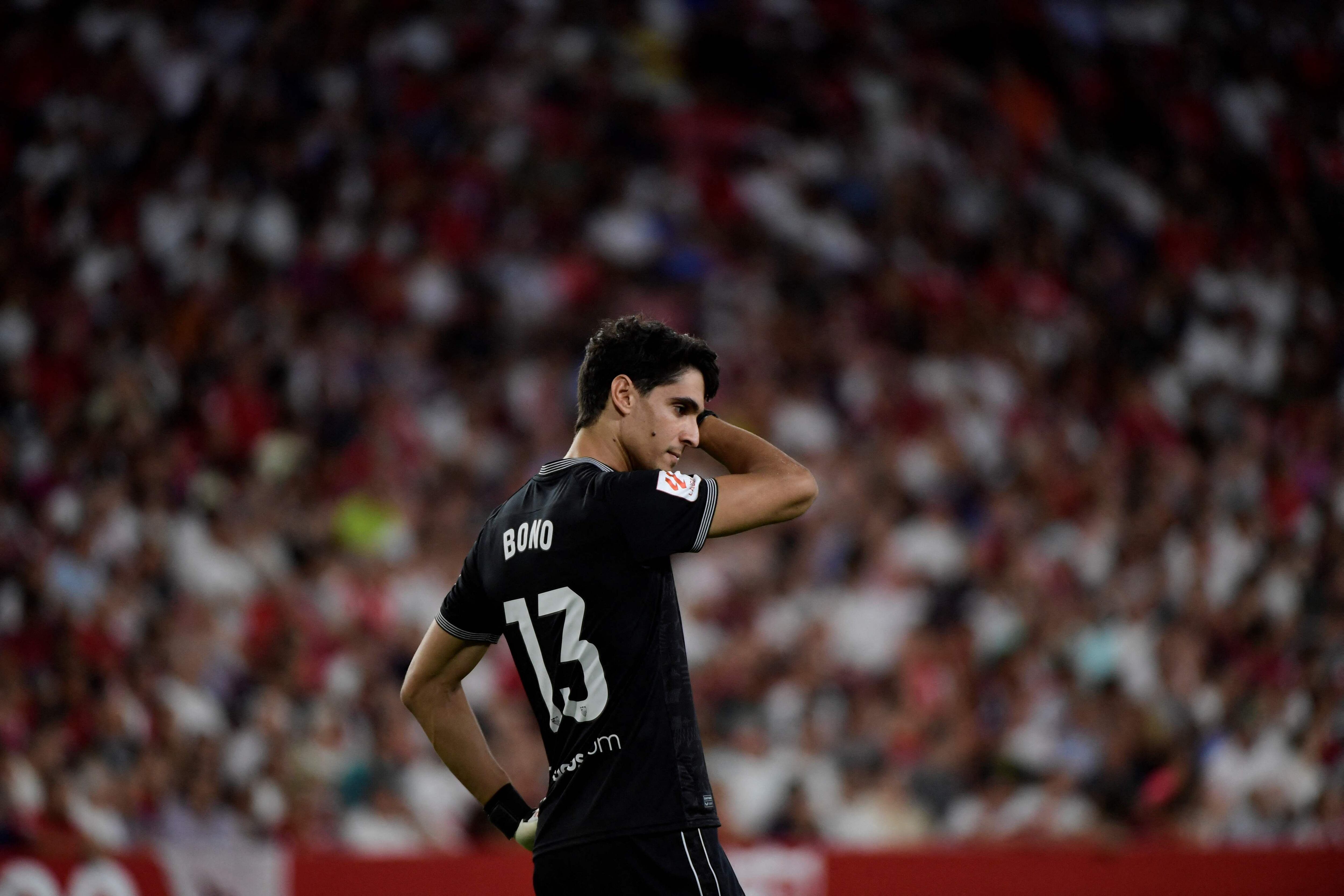 Sevilla's Moroccan goalkeeper #13 Yassine Bounou "Bono" reacts during the Spanish Liga football match between Sevilla FC and Valencia CF at the Ramon Sanchez Pizjuan stadium in Seville on August 11, 2023. (Photo by CRISTINA QUICLER / AFP)