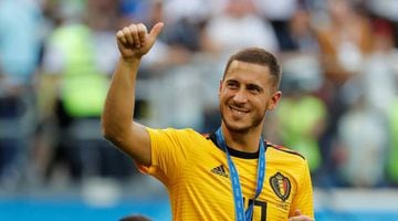 Belgium's Eden Hazard celebrates with a medal after the match