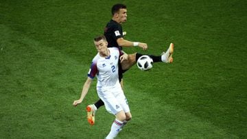 ROSTOV-ON-DON, RUSSIA - JUNE 26:  Birkir Saevarsson of Iceland is challenged by Ivan Perisic of Croatia during the 2018 FIFA World Cup Russia group D match between Iceland and Croatia at Rostov Arena on June 26, 2018 in Rostov-on-Don, Russia.  (Photo by C