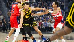 Dec 22, 2023; San Francisco, California, USA; Golden State Warriors guard Stephen Curry (30) dribbles away from pressure by Washington Wizards guard Jordan Poole (13) during the first quarter at Chase Center. Mandatory Credit: D. Ross Cameron-USA TODAY Sports