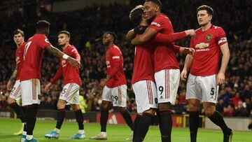 Manchester United&#039;s French striker Anthony Martial (2R) celebrates scoring their third goal during the English Premier League football match between Manchester United and Norwich City at Old Trafford in Manchester
