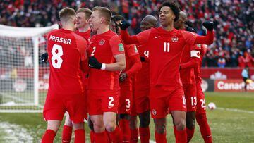 TORONTO, ON - MARCH 27: Canada players Liam Fraser #8, Alistair Johnson #2, Tajon Buchanan #11 and teammates celebrate a goal by Junior Hoilett #10 during a 2022 World Cup Qualifying match against Jamaica at BMO Field on March 27, 2022 in Toronto, Ontario