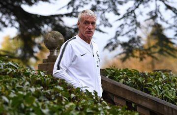 France's head coach Didier Deschamps walks at the French national football team training base in Clairefontaine-en-Yvelines.