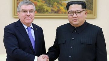 TOPSHOT - This undated picture released by North Korea&#039;s official Korean Central News Agency (KCNA) on March 31, 2018 shows North Korean leader Kim Jong-Un (R) shaking hands with President of the International Olympic Committee Thomas Bach. North Ko