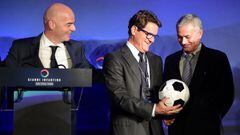 UEFA general secretary Gianni Infantino (L) watches as Fabio Capello (C) speaks with former Chelsea coach Portugal&#039;s Jose Mourinho after a press conference at Wembley stadium in London on February 1, 2016.  A stellar cast of football figures includi