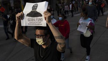 MINNEAPOLIS, MN - MAY 28: Protesters march through the street on May 28, 2020 in downtown Minneapolis, Minnesota. Police and protesters continued to clash for a third night after George Floyd was killed in police custody on Monday.   Stephen Maturen/Getty