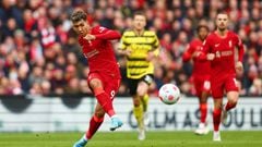 LIVERPOOL, ENGLAND - APRIL 02: Roberto Firmino of Liverpool shoots during the Premier League match between Liverpool and Watford at Anfield on April 02, 2022 in Liverpool, England. (Photo by Clive Brunskill/Getty Images)