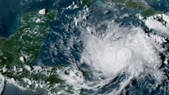 This NOAA/GOES satellite image shows Tropical Storm Nana (R) in the Caribbean at 22:00UTC, on September 1, 2020. - Nana will pass near the coast of Honduras on September 2, before intensifying and reaching Belize one day later, the Miami-based National Hu