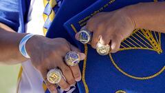 A fan shows off replica championship rings outside the Chase Center