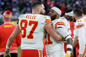 Jan 28, 2024; Baltimore, Maryland, USA; Kansas City Chiefs tight end Travis Kelce (87) celebrates with Chiefs safety Mike Edwards (21) on the sidelines Baltimore Ravens in the final minutes during the fourth quarter in the AFC Championship football game at M&T Bank Stadium. Mandatory Credit: Geoff Burke-USA TODAY Sports