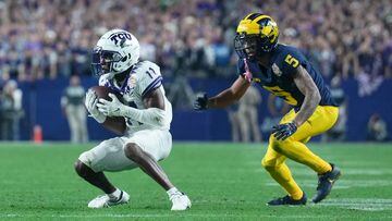 TCU Horned Frogs wide receiver Derius Davis (11) makes a catch in front of Michigan Wolverines defensive back DJ Turner (5)