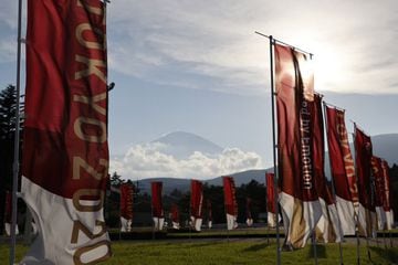 Mount Fuji is seen behind Tokyo 2020 flags at the Fuji International Speedway, the finishing point for the men's and women's road races at the Olympic Games.