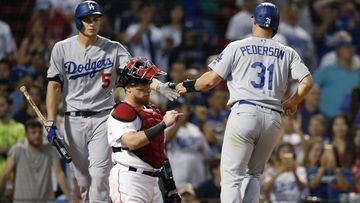Los Angeles Dodgers&#039; Joc Pederson (31) celebrates with Corey Seager (5) behind Boston Red Sox&#039;s Christian Vazquez after scoring on a bases-loaded walk during the 12th inning of a baseball game in Boston, Monday, July 15, 2019. (AP Photo/Michael Dwyer)