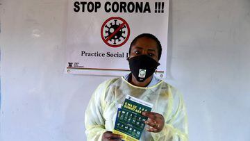 General Manager of the Lagos State Environmental Protection Agency (LASEPA) Dolapo Fasawe hold flyers to inform leaders of various unions who are schedule to train fellow members on measures to curb the spread of COVID-19 coronavirus ahead of the expected