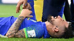 Brazil's defender #16 Alex Telles reacts after picking up an injury during the Qatar 2022 World Cup Group G football match between Cameroon and Brazil at the Lusail Stadium in Lusail, north of Doha on December 2, 2022. (Photo by Issouf SANOGO / AFP) (Photo by ISSOUF SANOGO/AFP via Getty Images)
