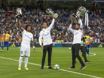 Marcelo, Cristiano Ronaldo and Sergio Ramos parade the Spanish Super Cup, UEFA Super Cup and LaLiga trophies.
