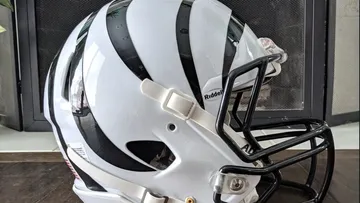 New York Giants - Navy helmet. White facemask. Scarlet stripe.