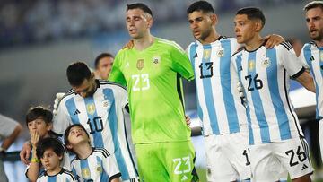 Soccer Football - International Friendly - Argentina v Panama - Estadio Monumental, Buenos Aires, Argentina - March 23, 2023 Argentina's Lionel Messi lines up with Emiliano Martinez and teammates during the national anthem before the match REUTERS/Agustin Marcarian