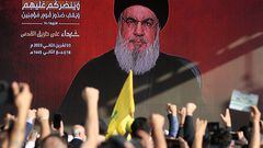 Lebanon's Hezbollah leader Sayyed Hassan Nasrallah appears on a screen as he addresses his supporters during a ceremony to honour fighters killed in the recent escalation with Israel, in Beirut's southern suburbs, Lebanon November 3, 2023. REUTERS/Mohamed Azakir