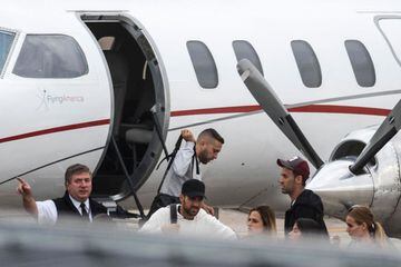 Barcelona's players Jordi Alba, Sergio Busquets and Cesc Fàbregas arrive at Rosario's airport to attend Messi's wedding.