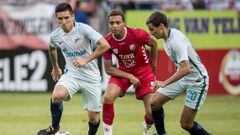 FK Zenit&#039;s Argentine midfielder Matias Kranevitter (L) and defender Emanuel Mamana (R) vie for the ball with FC Utrecht&#039;s Belgian forward Cyriel Dessers during the UEFA Europa League last qualifying round match between FC Utrecht and St Petersbu