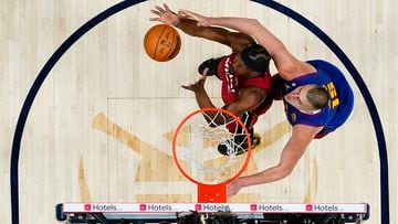 Jun 1, 2023; Denver, CO, USA; Miami Heat forward Jimmy Butler (22) battles for the ball against Denver Nuggets center Nikola Jokic (15) during the first half in game one of the 2023 NBA Finals at Ball Arena. Mandatory Credit: Jack Dempsey/Pool Photo-USA TODAY Sports